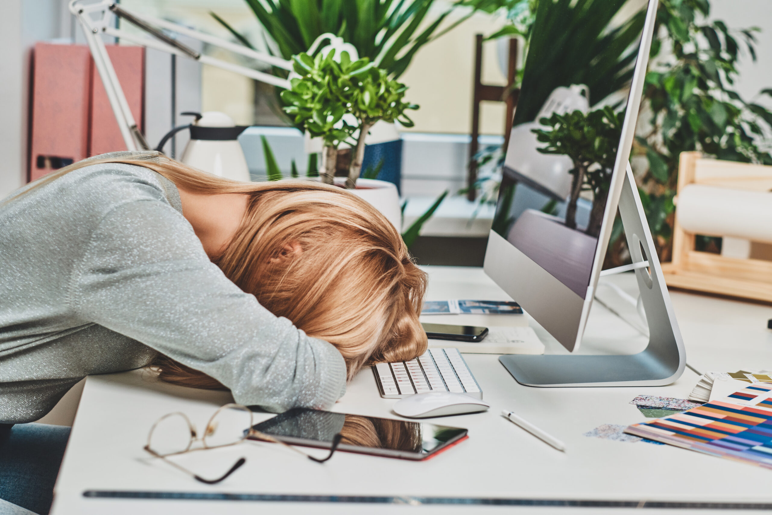 Woman is tired while working in office
